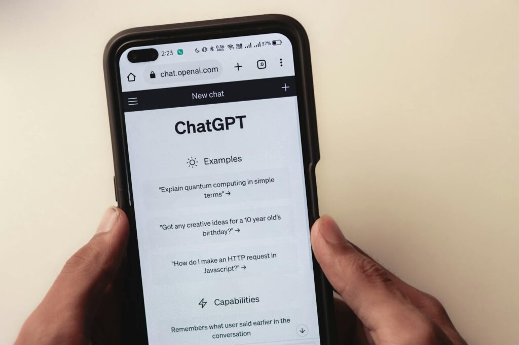 webpage of chatgpt a prototype ai chatbot is seen on the website of openai on a smartphone examples capabilities and limitations are shown