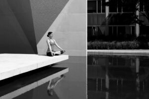 grayscale photography woman doing yoga